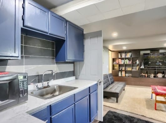 kitchen featuring blue cabinets and sink