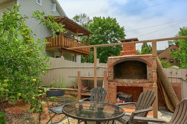 view of patio / terrace featuring an outdoor fireplace