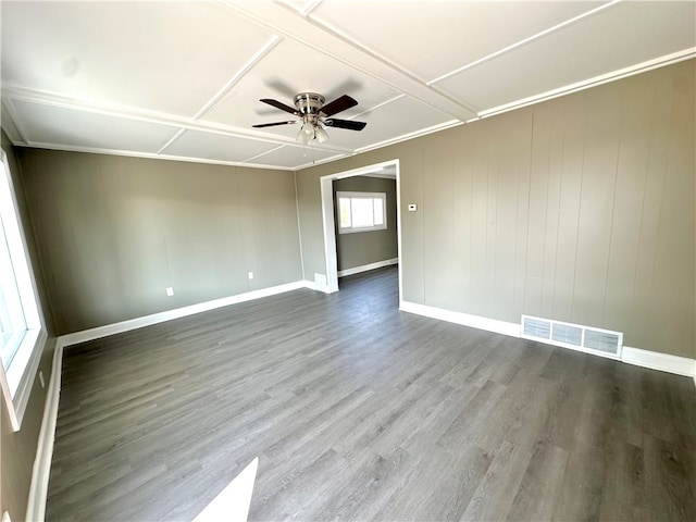 spare room with ceiling fan, wood-type flooring, and coffered ceiling