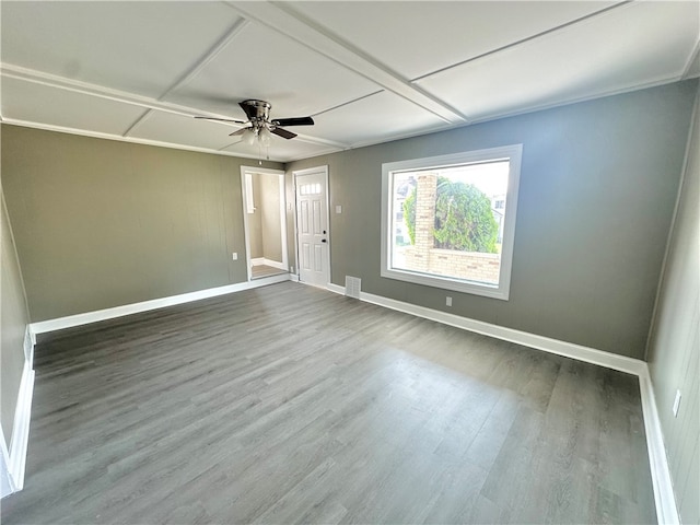 spare room featuring wood-type flooring and ceiling fan