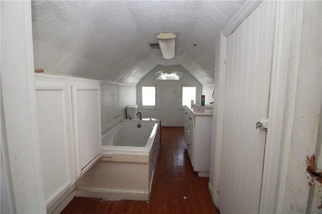 814 Etna St, Mckees Rocks, PA 15136 - full bathroom with lofted ceiling, a tub, vanity, and hardwood / wood-style flooring