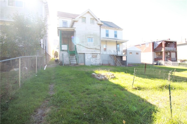 814 Etna St, Mckees Rocks, PA 15136 - rear view of house with stairway and an outdoor fire pit