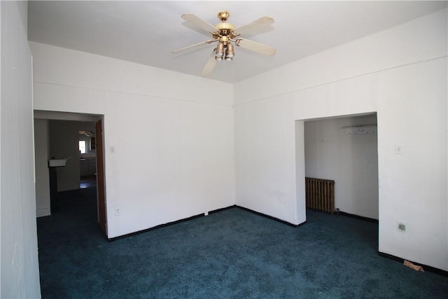 814 Etna St, Mckees Rocks, PA 15136 - empty room featuring radiator heating unit, dark carpet, a ceiling fan, and baseboards
