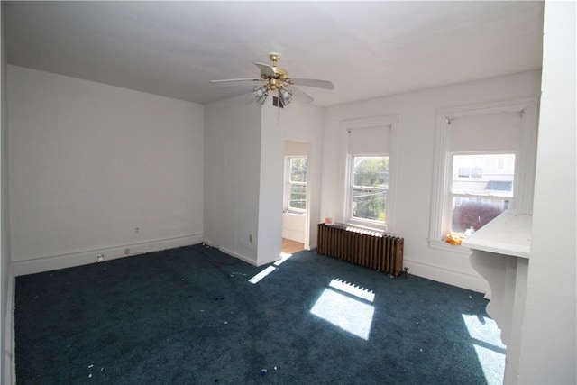 814 Etna St, Mckees Rocks, PA 15136 - empty room with radiator heating unit, carpet, ceiling fan, and baseboards
