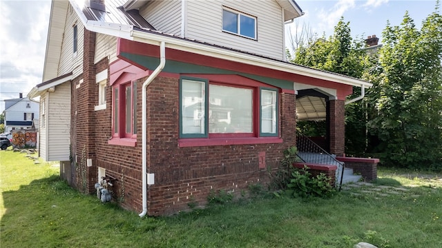 view of home's exterior featuring a yard