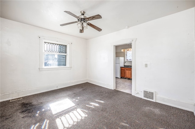 unfurnished room featuring ceiling fan and tile patterned floors