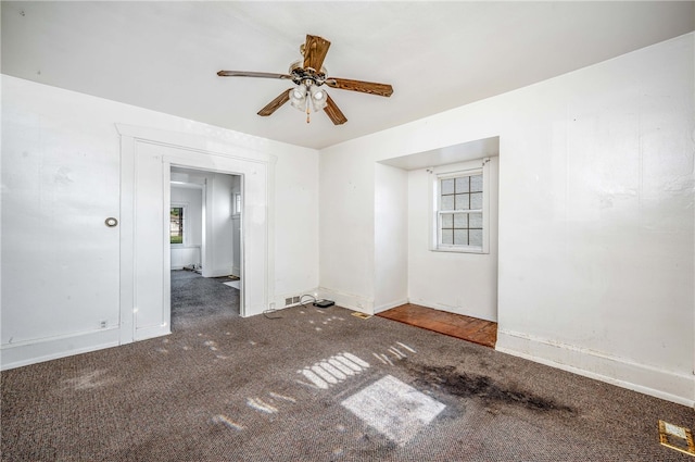 empty room featuring carpet and ceiling fan