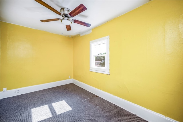 empty room with carpet flooring and ceiling fan