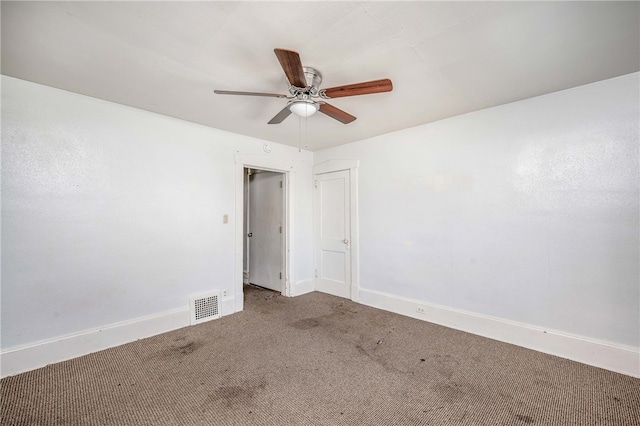 carpeted empty room featuring ceiling fan