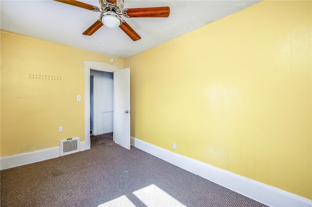 carpeted empty room with ceiling fan