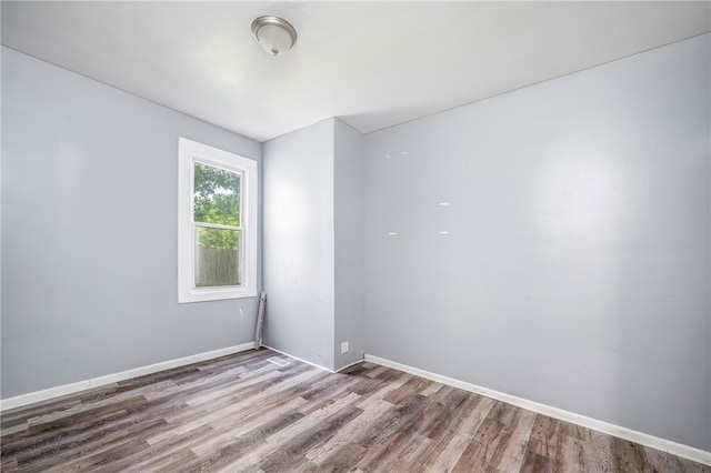 unfurnished room featuring hardwood / wood-style floors