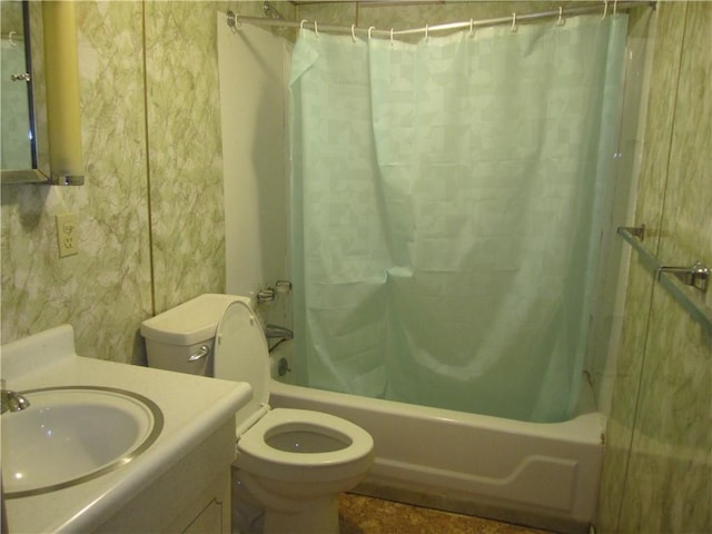 bathroom with wallpapered walls, vanity, toilet, and shower / bath combo with shower curtain