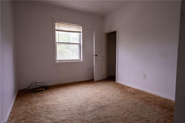 spare room featuring carpet