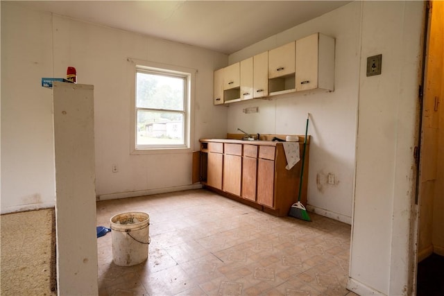 kitchen with sink and cream cabinetry