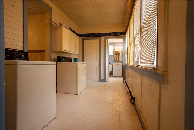 laundry area featuring cabinets and independent washer and dryer