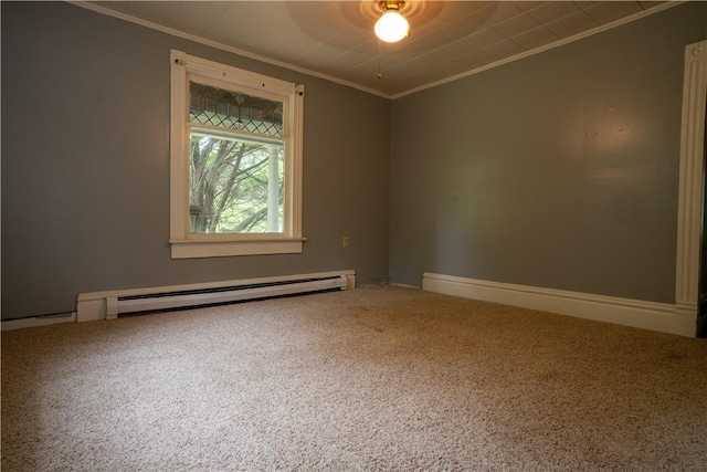 spare room featuring carpet, a baseboard heating unit, and ornamental molding