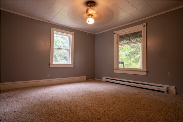 carpeted empty room with crown molding and a baseboard radiator