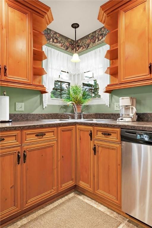 kitchen featuring sink, dishwasher, and decorative light fixtures