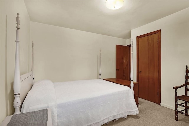 bedroom with light colored carpet and a closet