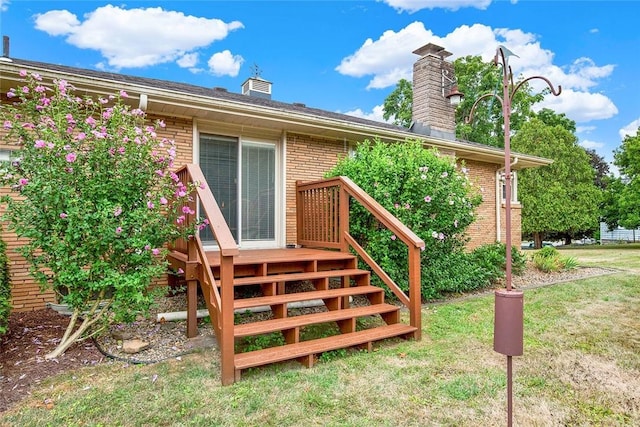 doorway to property with a yard