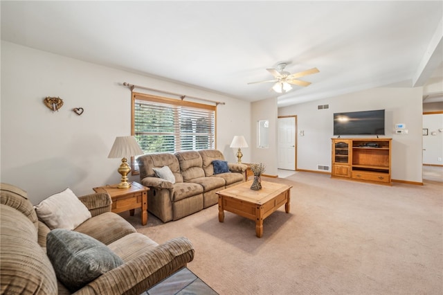 carpeted living room featuring ceiling fan