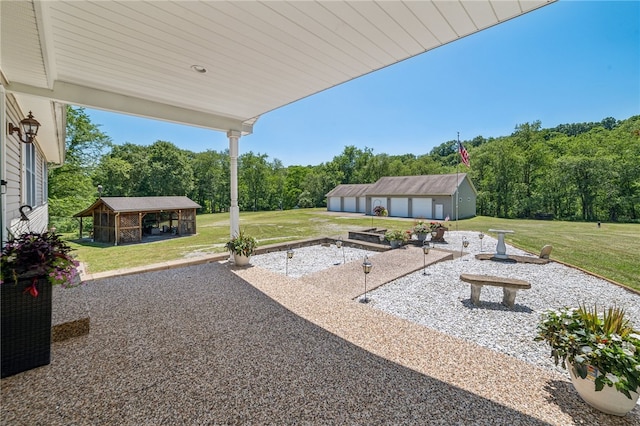 view of patio featuring an outdoor structure