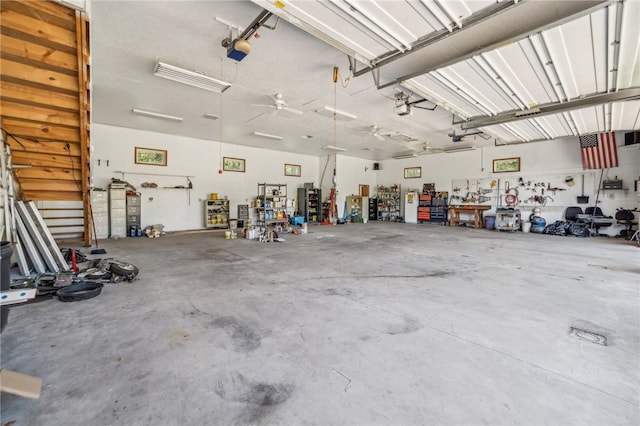 garage with ceiling fan and a workshop area