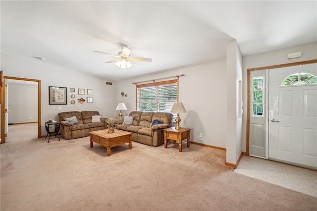 living room featuring carpet flooring and ceiling fan