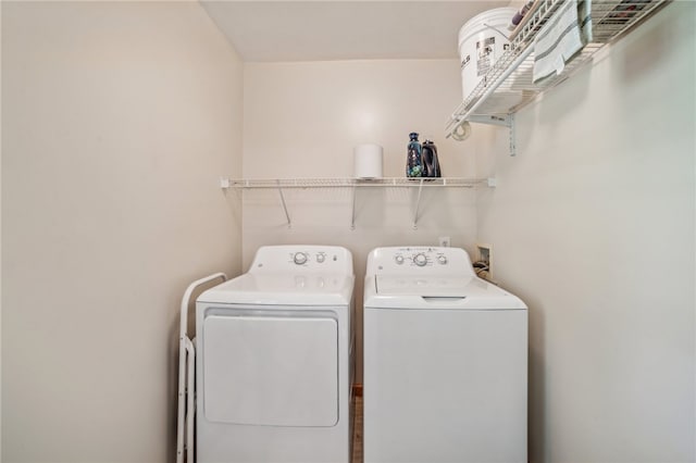 washroom with separate washer and dryer