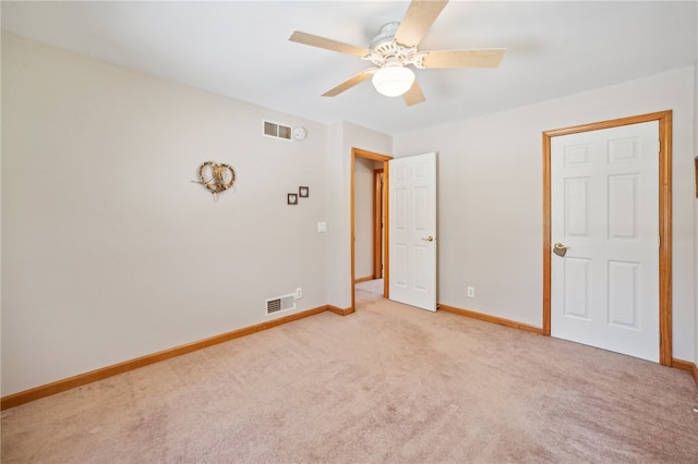 unfurnished bedroom featuring ceiling fan and carpet flooring