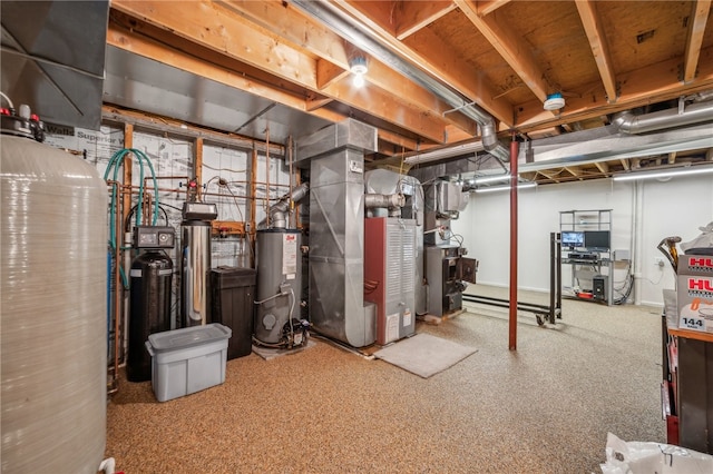 basement featuring heating unit and water heater