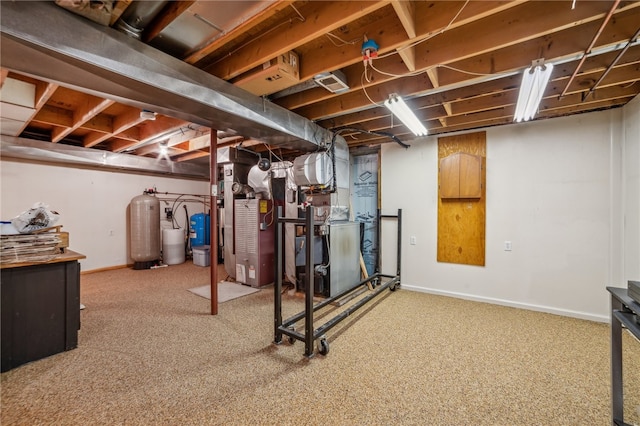 basement featuring carpet flooring and heating unit