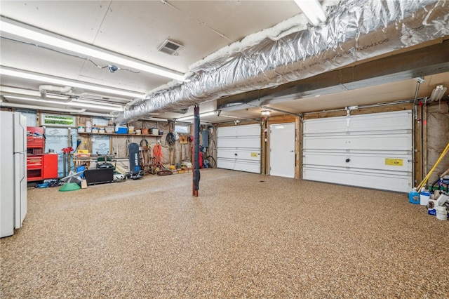 garage featuring white refrigerator