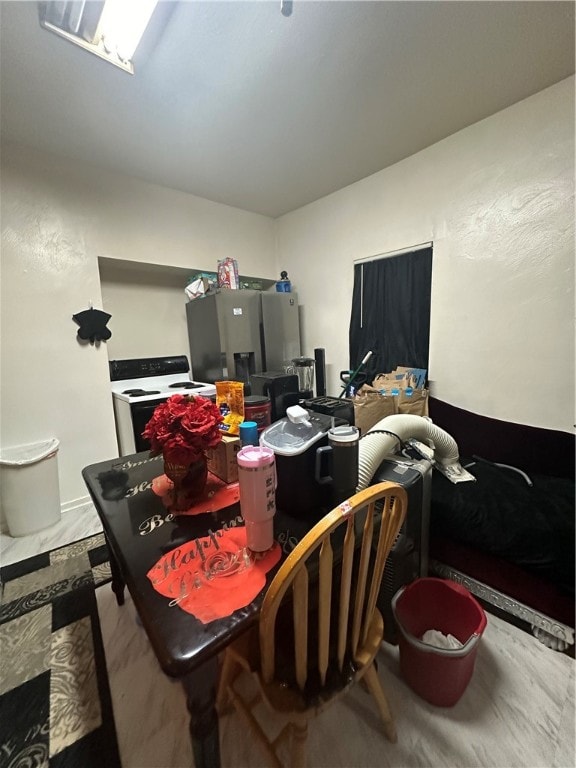 dining area featuring tile patterned flooring