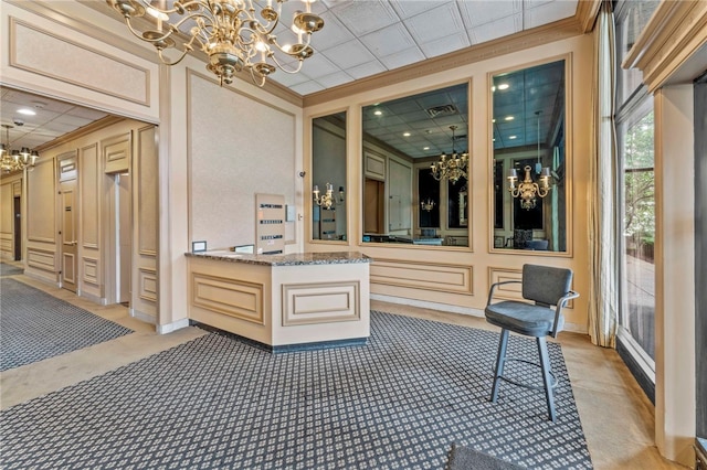 112 Washington Pl Unit 7E, Downtown Pgh, PA 15219 - welcome area with a chandelier, ornamental molding, and a decorative wall