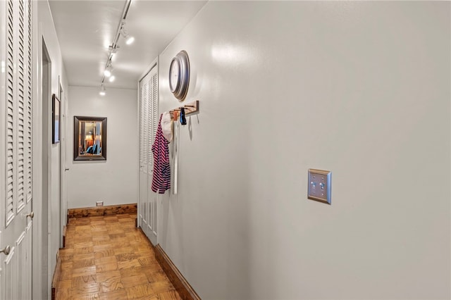 112 Washington Pl Unit 7E, Downtown Pgh, PA 15219 - hallway featuring rail lighting and baseboards