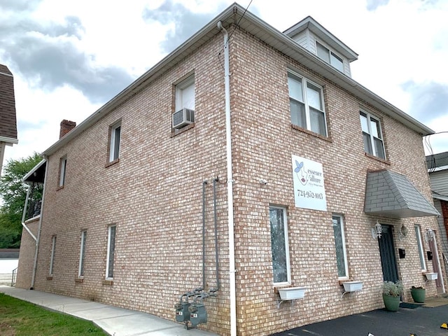 view of property exterior with cooling unit