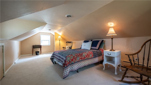 carpeted bedroom featuring baseboard heating and lofted ceiling