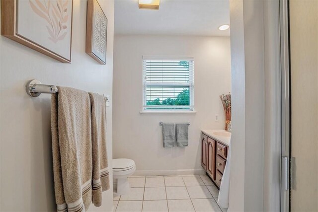 bathroom featuring vanity, toilet, and tile patterned floors