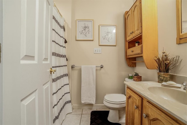 bathroom featuring vanity, toilet, and tile patterned floors