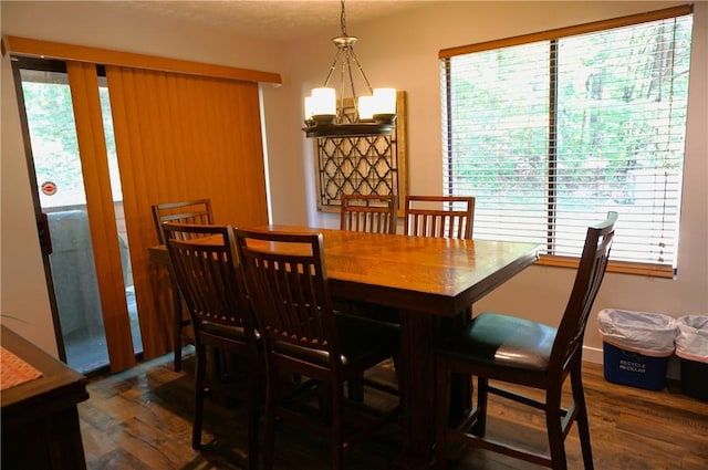 dining room featuring a chandelier and wood finished floors