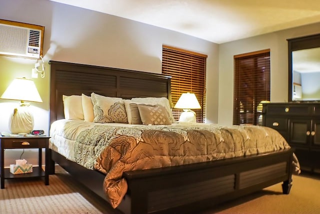 bedroom featuring a wall mounted AC and carpet