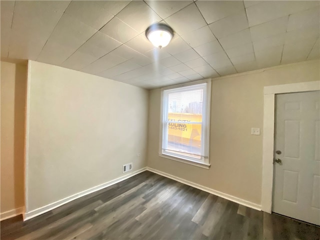 empty room with dark hardwood / wood-style floors