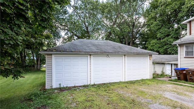 garage featuring a yard