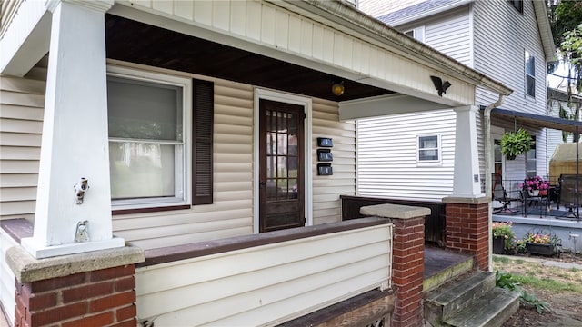 doorway to property with a porch