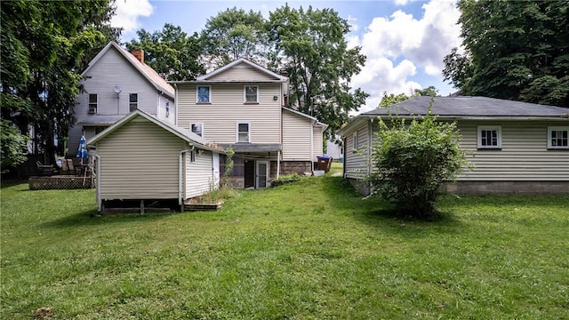 back of house with a yard