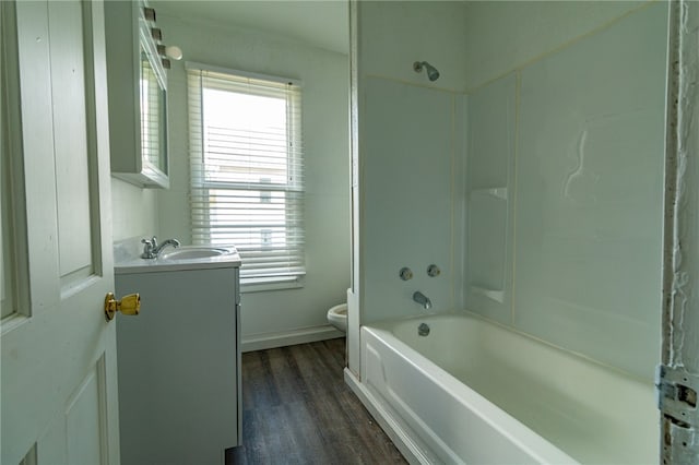 full bathroom featuring shower / bath combo with shower curtain, toilet, vanity, and hardwood / wood-style flooring