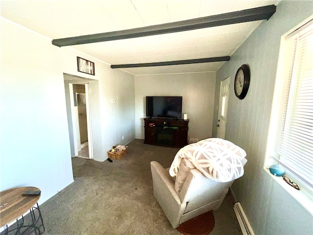 sitting room featuring beamed ceiling and carpet flooring