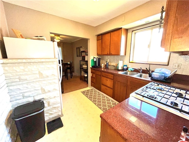 kitchen with ceiling fan and sink