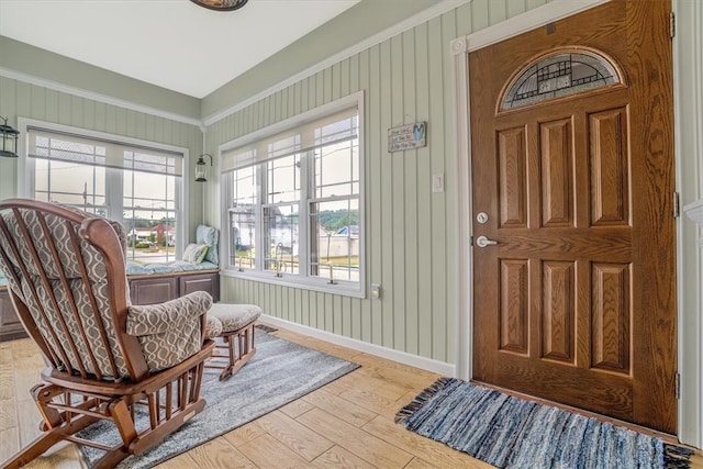 foyer entrance with a healthy amount of sunlight and light hardwood / wood-style floors